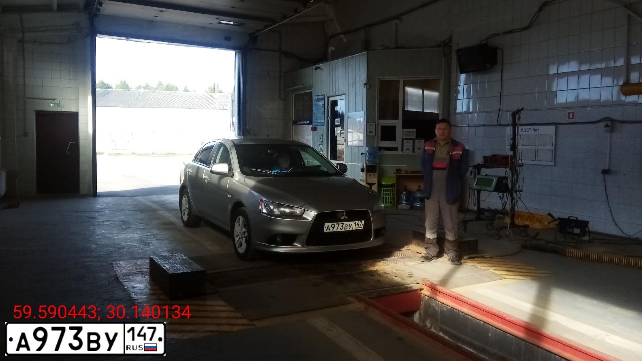 Фото автомобиля MITSUBISHI LANCER, 2011 — госномер К673ОР178. Цвет: Серебристый
