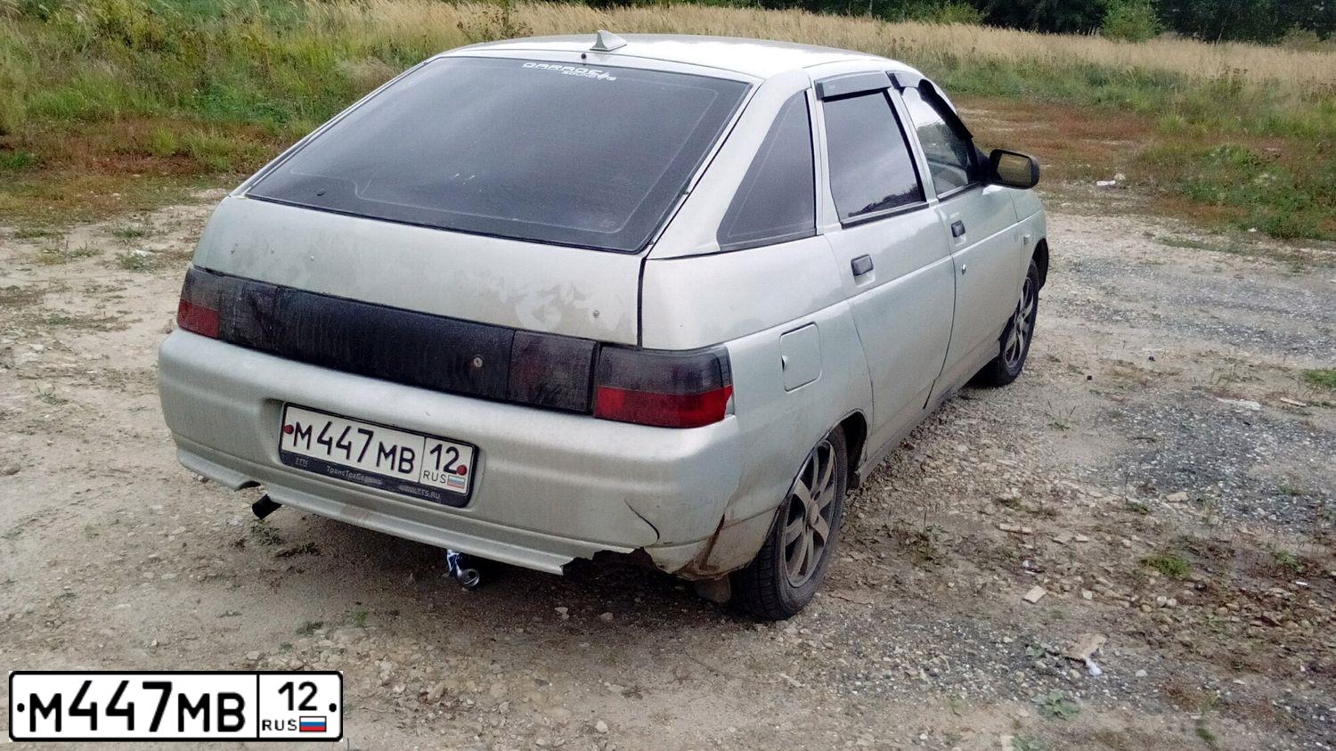Фото автомобиля LADA 2112, 2001 — госномер М447МВ12. Цвет: СЕРЕБР.ЖЕЛТО-ЗЕЛЕНЫЙ