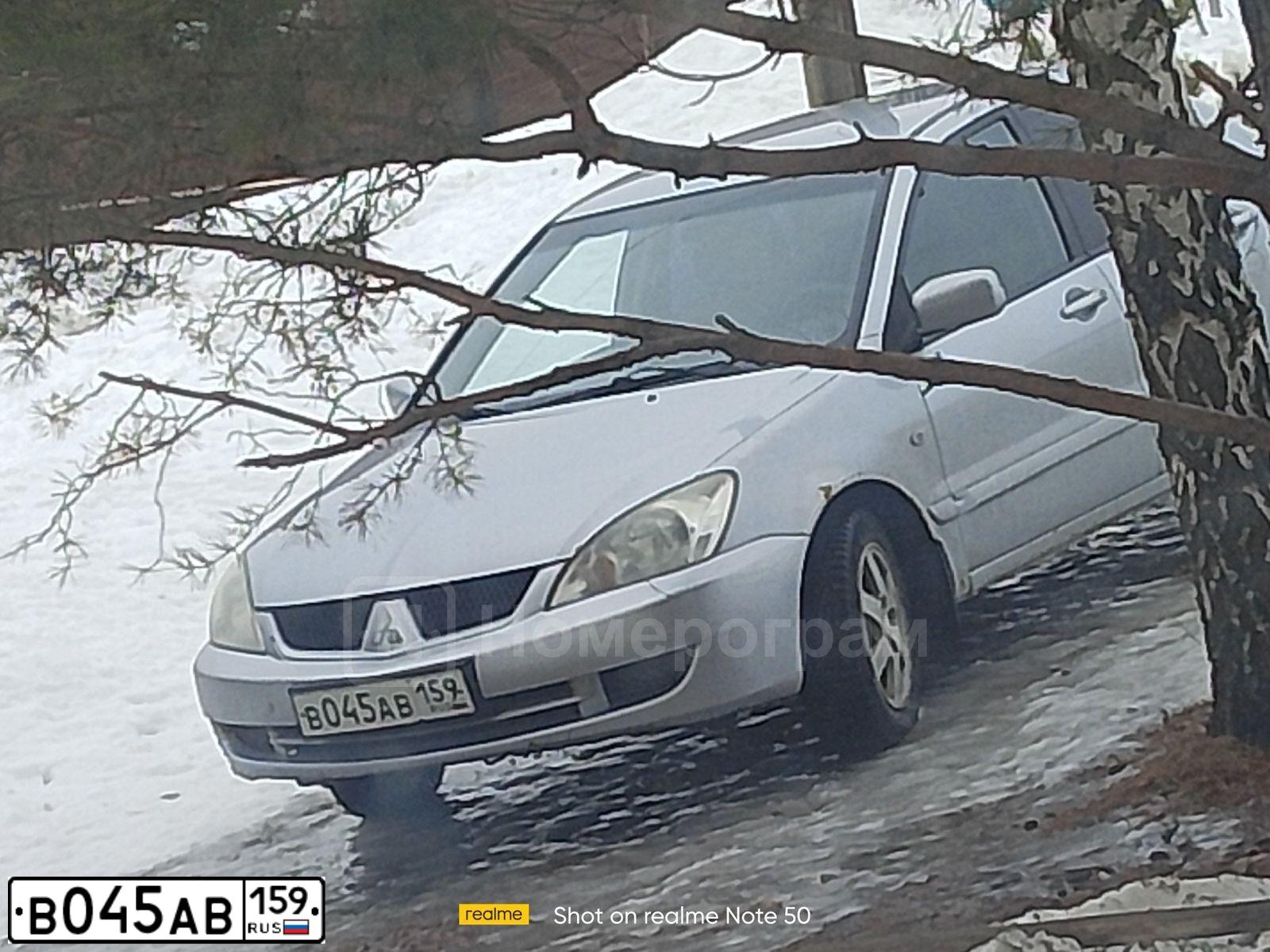 Фото автомобиля MITSUBISHI LANCER, 2007 — госномер В045АВ159. Цвет: СЕРЕБРИСТЫЙ