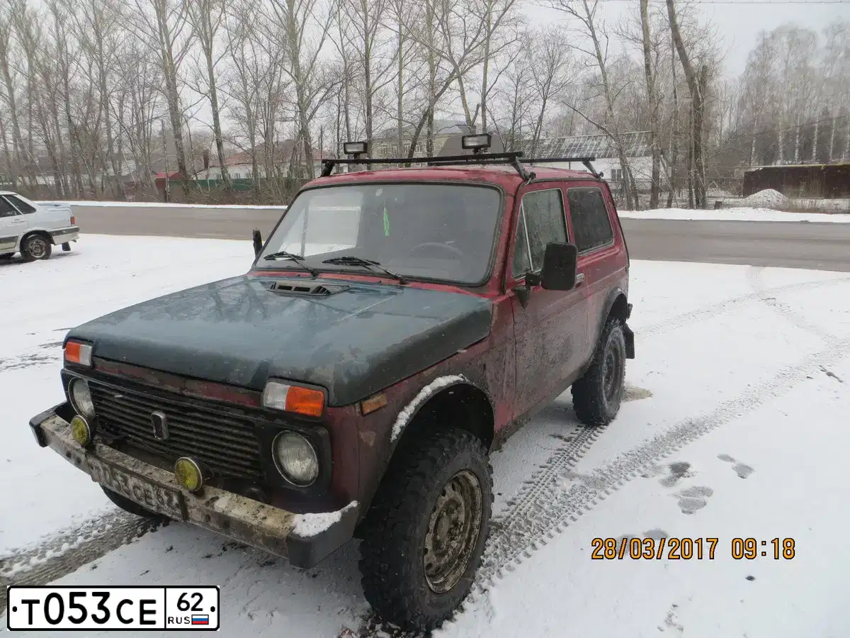 Фото автомобиля LADA 2121 NIVA, 1997 — госномер Т053СЕ62. Цвет: ВИШНЕВЫЙ