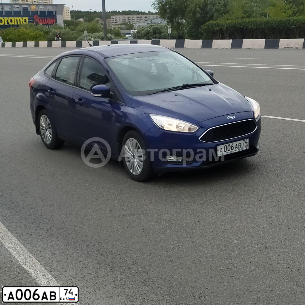 Фото автомобиля FORD FOCUS, 2012 — госномер А006АВ74. Цвет: ТЕМНО-СИНИЙ