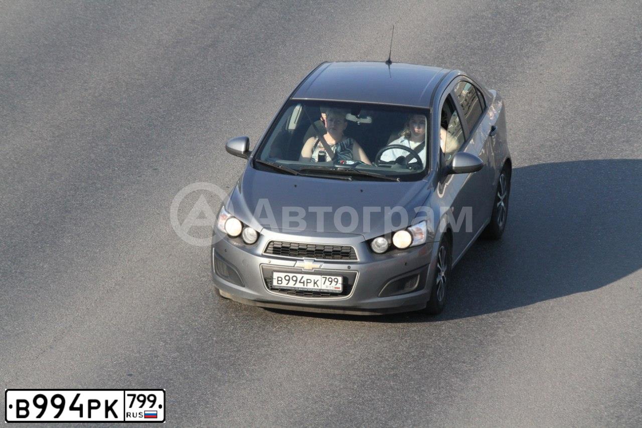 Фото автомобиля CHEVROLET T AVEO, 2013 — госномер В994РК799. Цвет: СЕРЫЙ