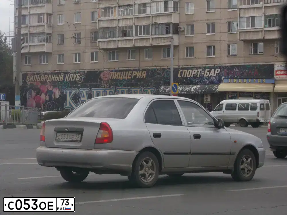 Фото автомобиля TAGAZ ACCENT, 2005 — госномер С053ОЕ73. Цвет: СЕРЫЙ СВЕТЛЫЙ