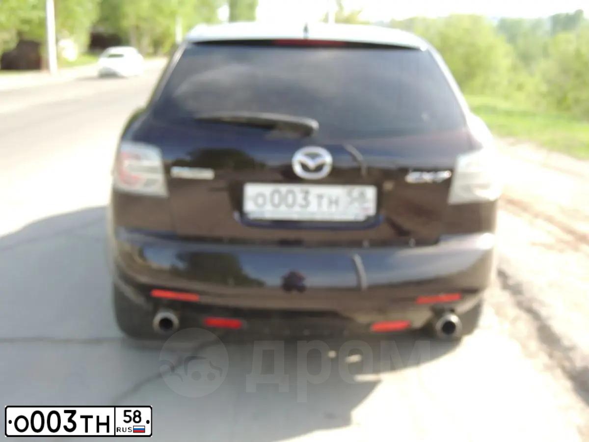 Фото автомобиля MAZDA CX-7, 2007 — госномер К070УР58. Цвет: ТЕМНО-ВИШНЕВЫЙ