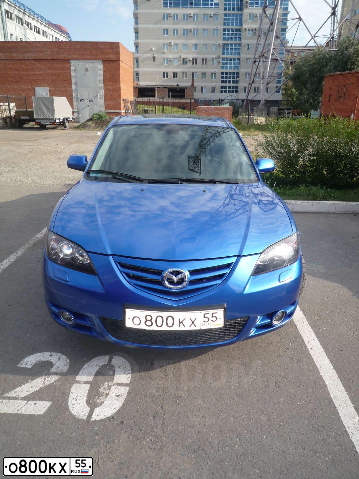 Фото автомобиля MAZDA 3, 2006 — госномер Е023ВВ89. Цвет: СВЕТЛО-СИНИЙ