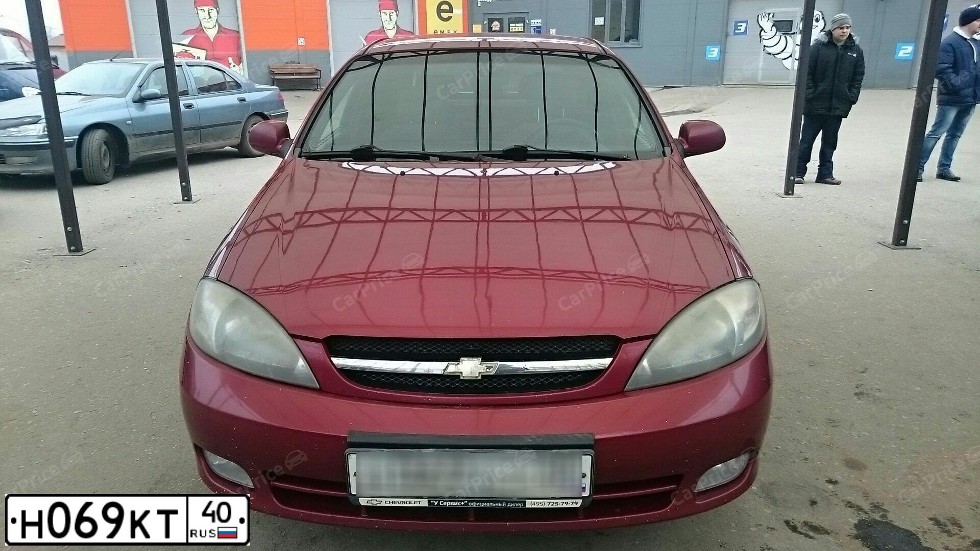 Фото автомобиля CHEVROLET LACETTI, 2007 — госномер Н069КТ40. Цвет: ТЕМНО-КРАСНЫЙ