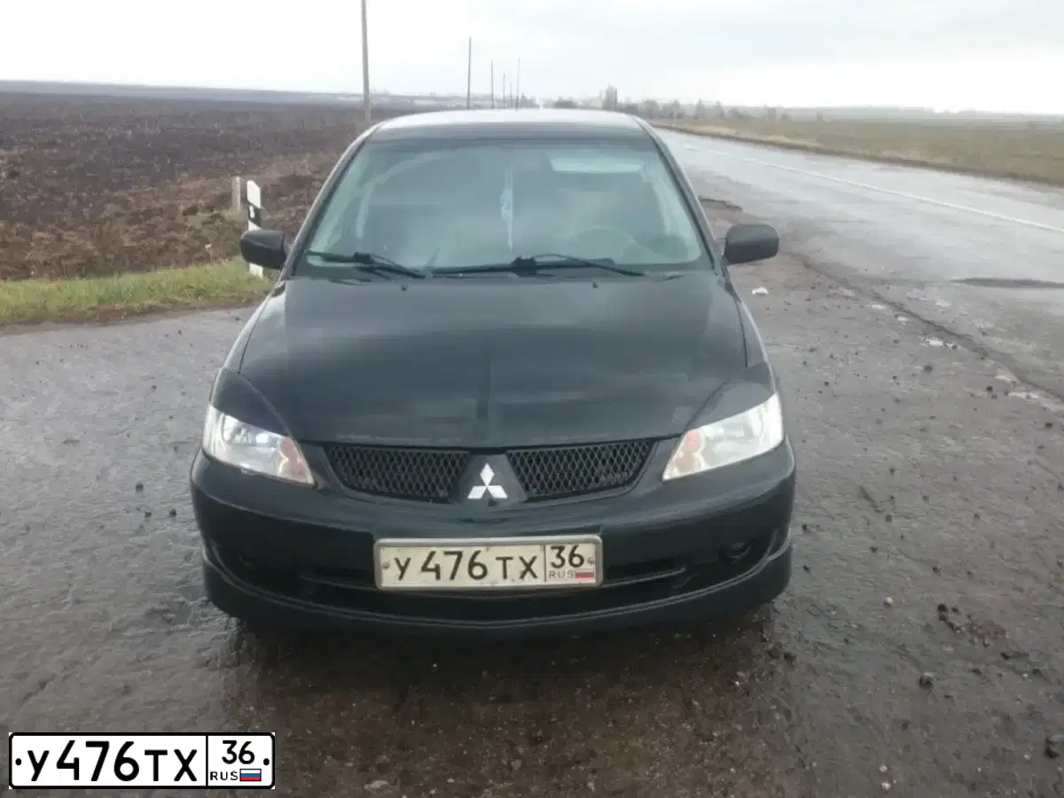 Фото автомобиля MITSUBISHI LANCER, 2006 — госномер У476ТХ36. Цвет: ЧЕРНЫЙ
