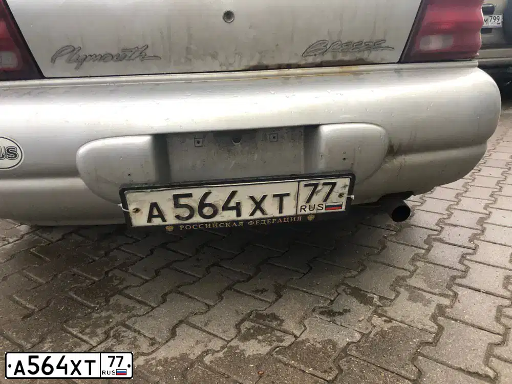 Фото автомобиля PLYMOUTH BREEZE, 1999 — госномер А564ХТ77. Цвет: СЕРЫЙ