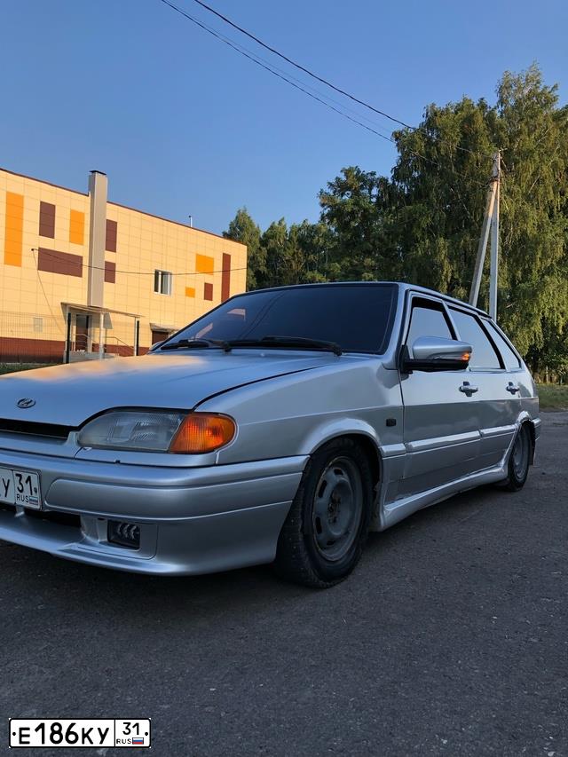 Фото автомобиля LADA 2114 SAMARA, 2005 — госномер Е186КУ31. Цвет: СВЕТЛО-СЕРЕБРИСТЫЙ МЕТАЛЛ