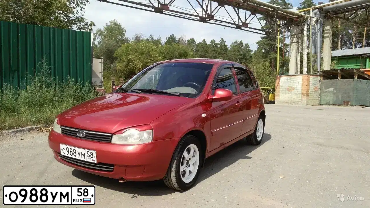 Фото автомобиля LADA 1119 KALINA, 2007 — госномер О988УМ58. Цвет: СЕРЕБРИСТО-КРАСНЫЙ