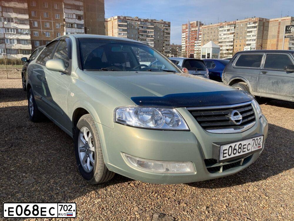 Фото автомобиля NISSAN ALMERA, 2009 — госномер Х197АЕ774. Цвет: СЕРО-ЗЕЛЕНЫЙ
