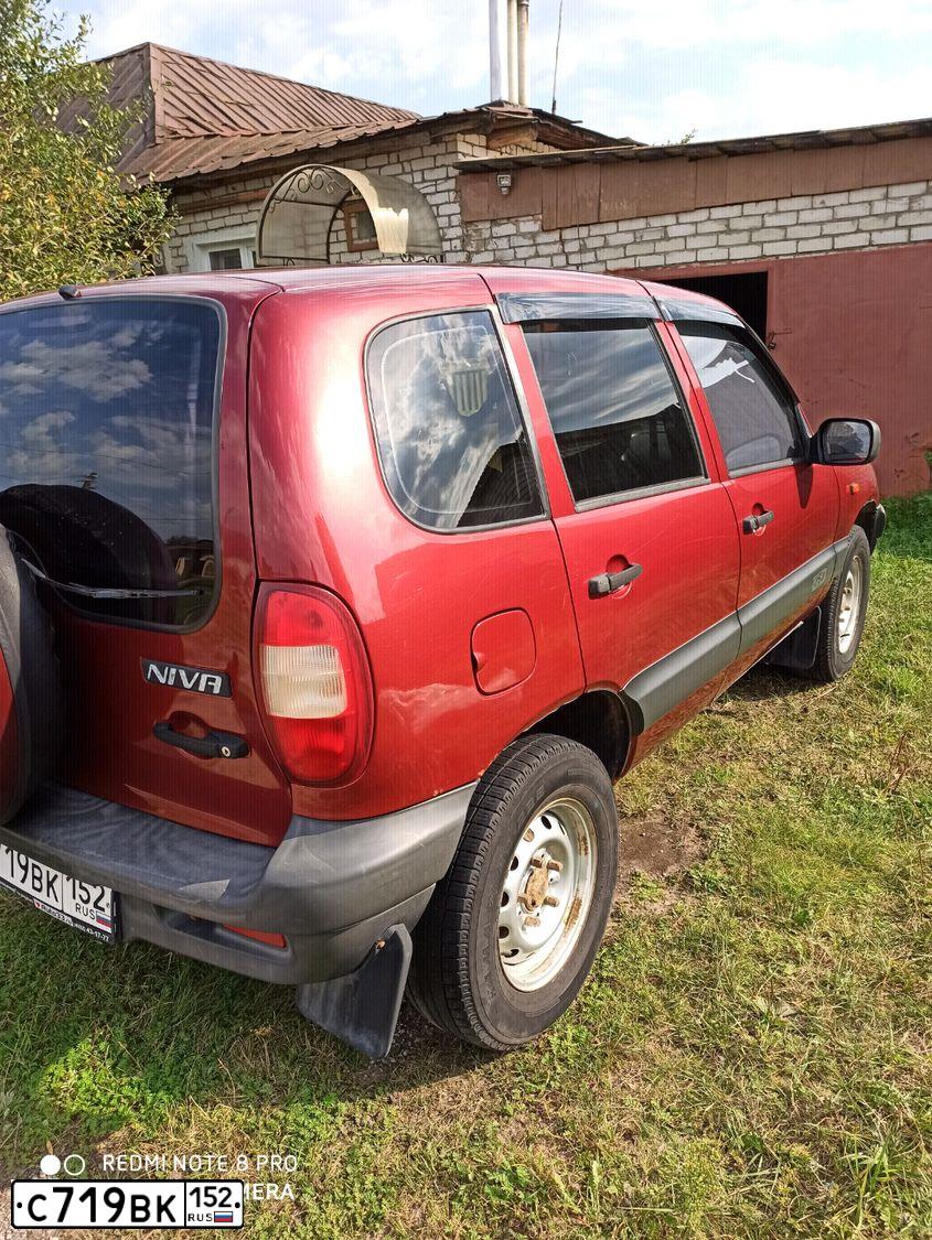 Фото автомобиля CHEVROLET ШЕВРОЛЕ НИВА, 2006 — госномер С719ВК152. Цвет: Ярко-красный металлик