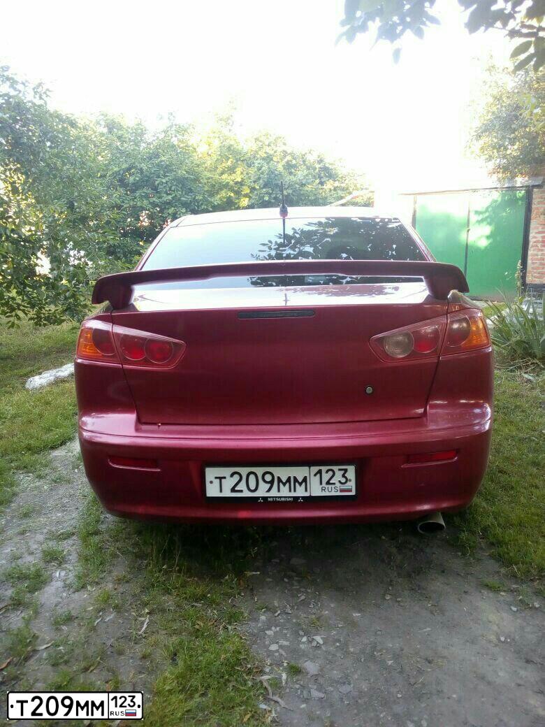 Фото автомобиля MITSUBISHI LANCER, 2007 — госномер А335МХ761. Цвет: Красный
