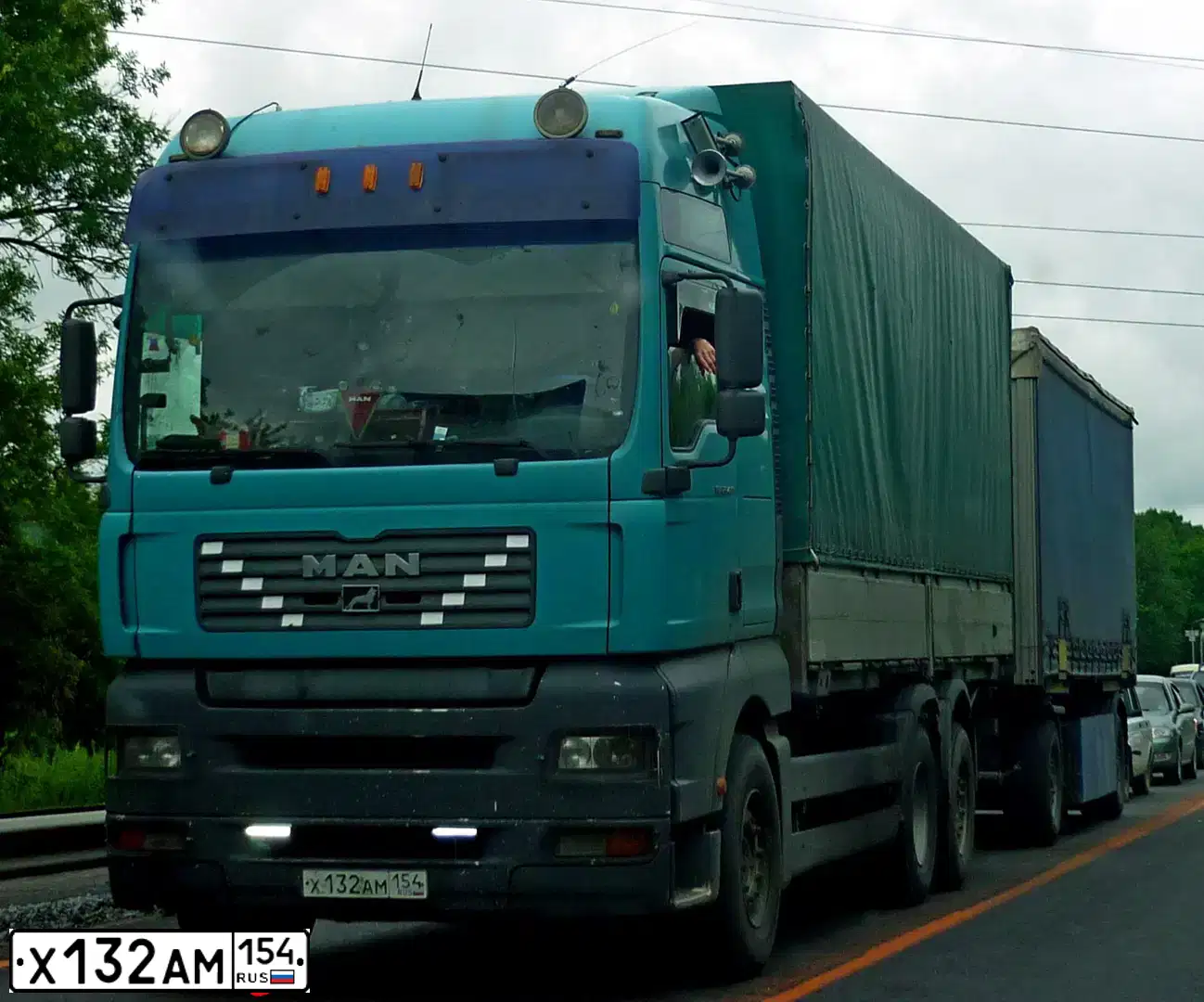 Фото автомобиля MAN TGS, 2002 — госномер Х419НК142. Цвет: ГОЛУБОЙ