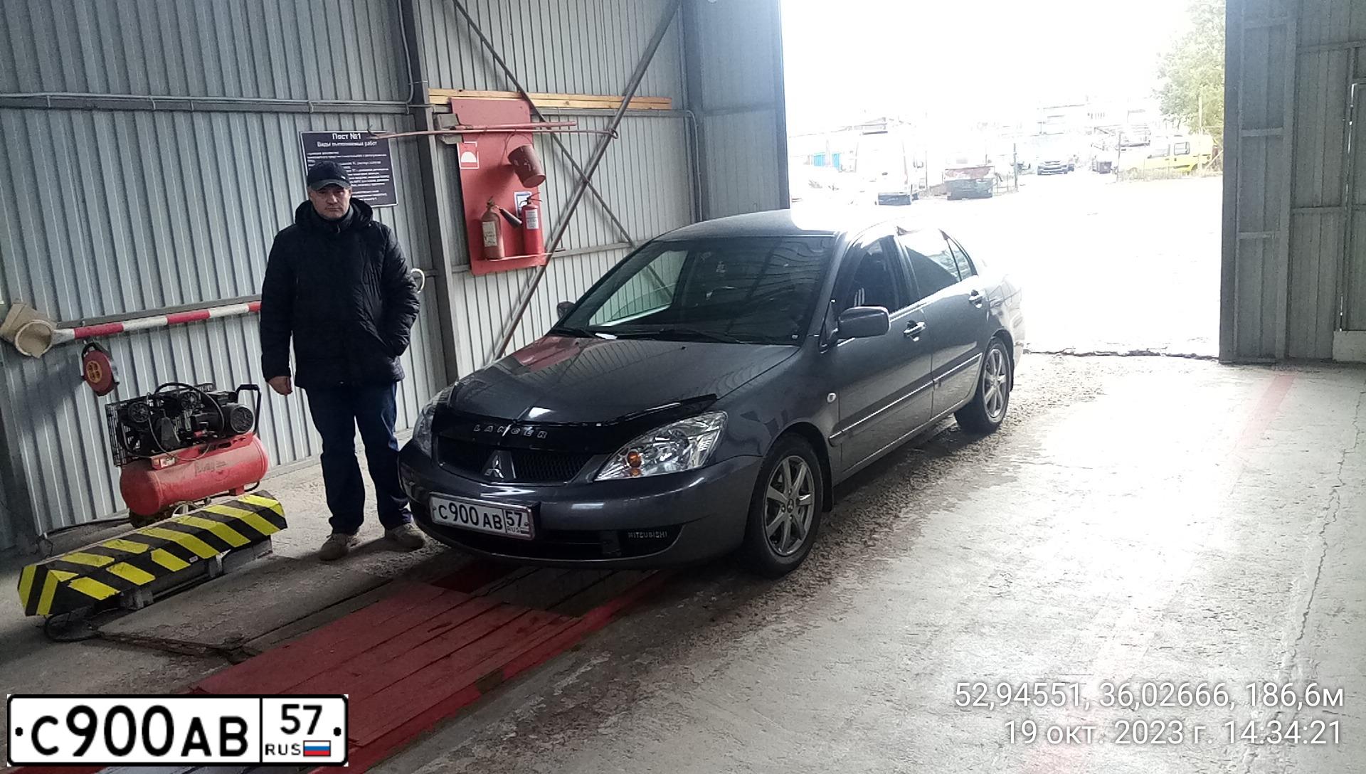 Фото автомобиля MITSUBISHI LANCER, 2006 — госномер К392ВХ57. Цвет: СЕРЫЙ