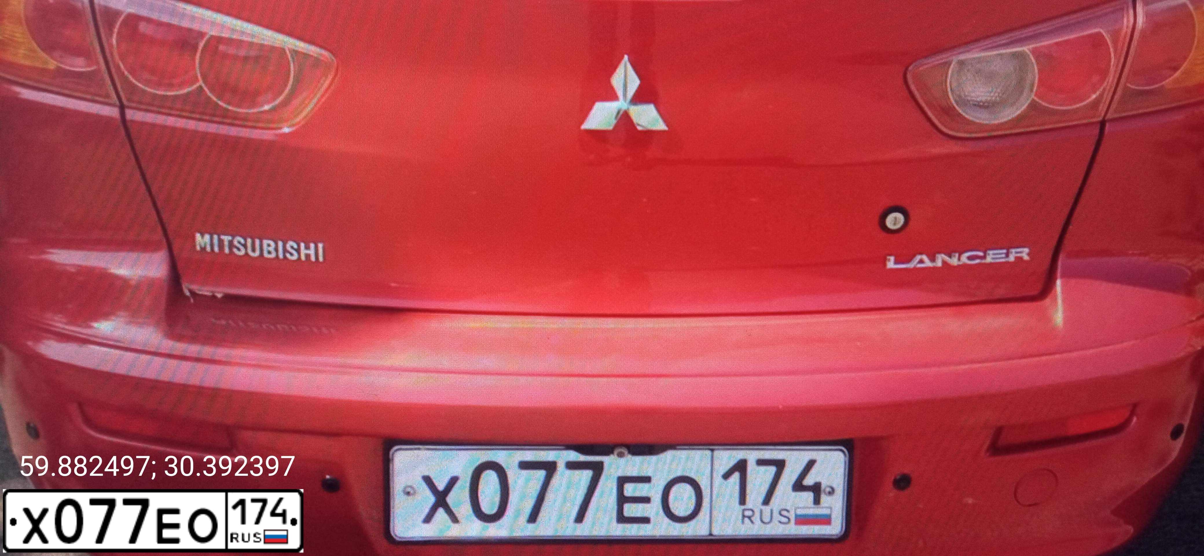 Фото автомобиля MITSUBISHI LANCER, 2007 — госномер Х077ЕО174. Цвет: Красный