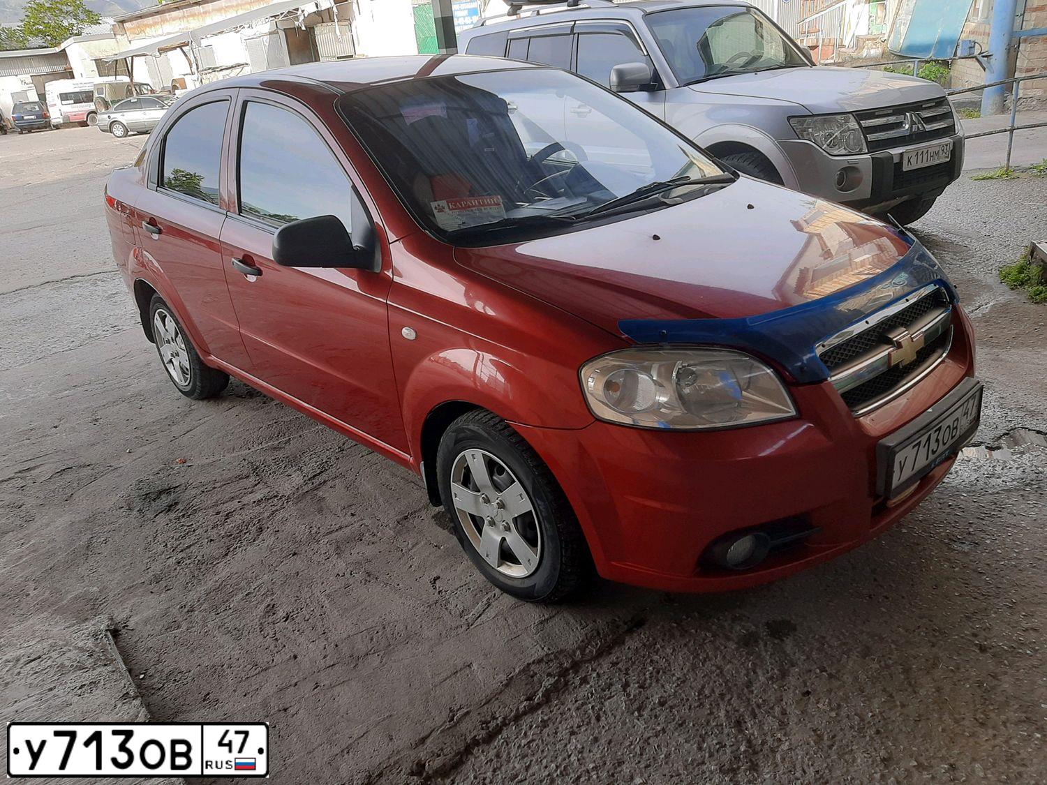 Фото автомобиля CHEVROLET AVEO, 2007 — госномер Е643ХХ82. Цвет: Красный