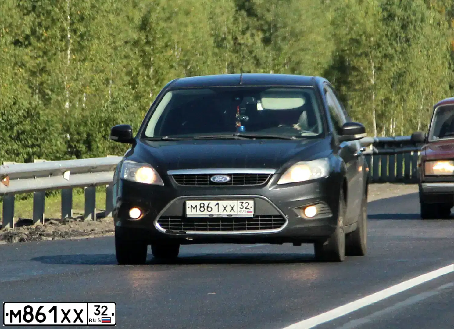 Фото автомобиля FORD FOCUS, 2011 — госномер Н601НС197. Цвет: ЧЕРНЫЙ