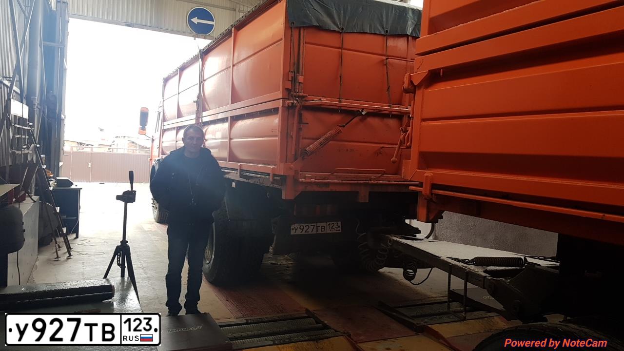 Фото автомобиля KAMAZ 65115 /6X4/, 2008 — госномер Н218ЕХ777. Цвет: Оранжевый
