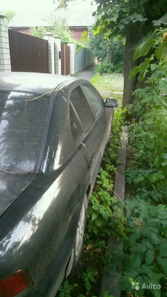 Фото автомобиля MITSUBISHI GALANT, 1998 — госномер Т393КТ790. Цвет: ЗЕЛЕНЫЙ