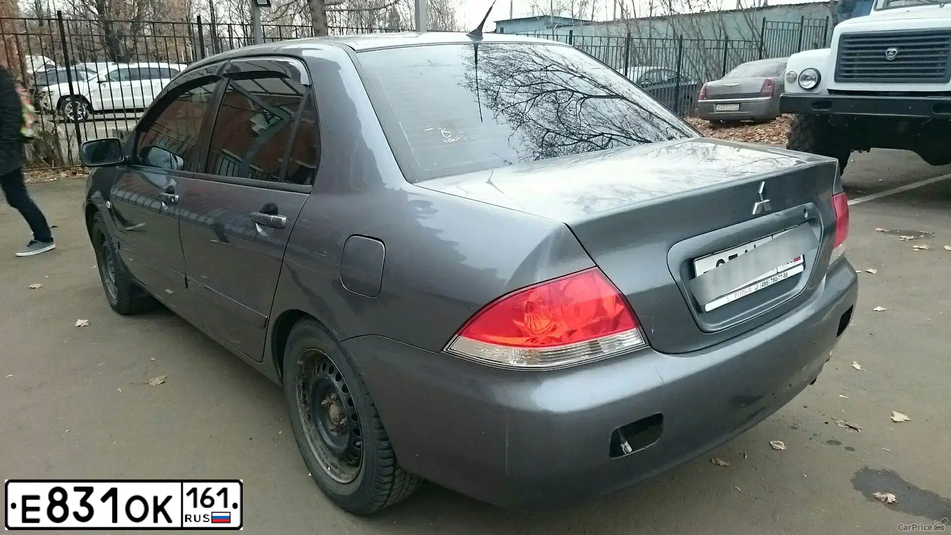 Фото автомобиля MITSUBISHI LANCER, 2006 — госномер Е831ОК161. Цвет: СЕРЫЙ
