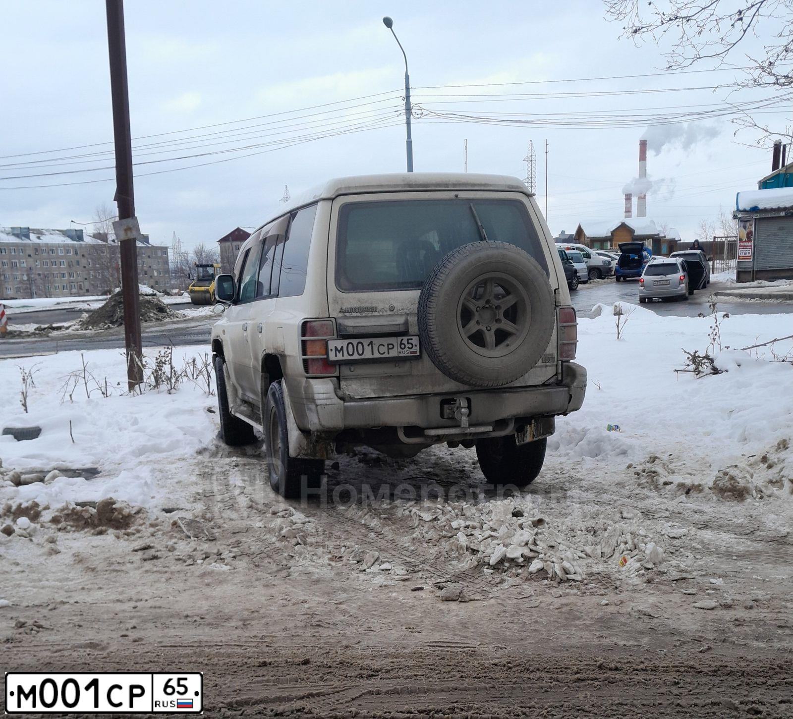 Фото автомобиля UAZ 3909, 2015 — госномер М001СР65. Цвет: СИНИЙ