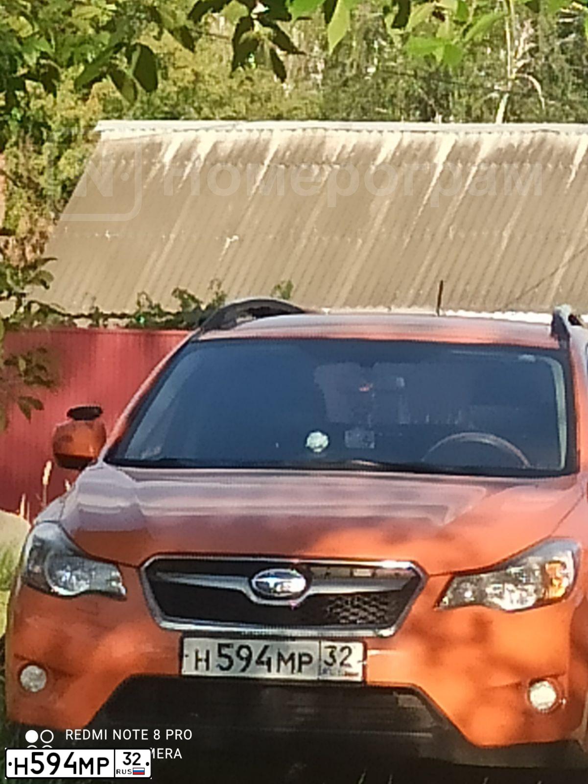 Фото автомобиля SUBARU IMPREZA, 2014 — госномер С056ОК178. Цвет: ОРАНЖЕВЫЙ