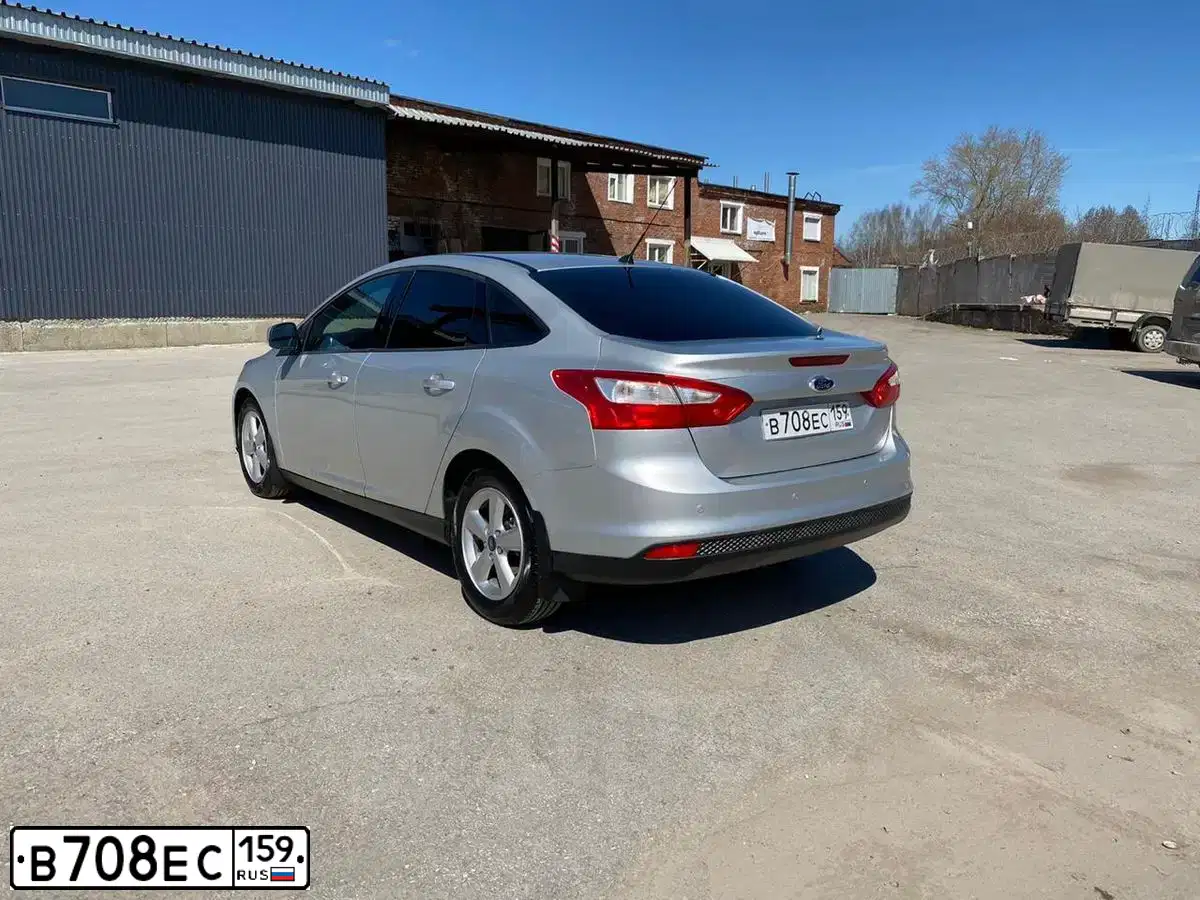 Фото автомобиля FORD FOCUS, 2012 — госномер Н603АУ159. Цвет: Серебристый