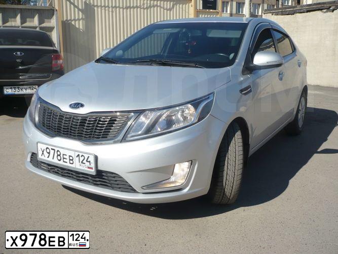 Фото автомобиля KIA RIO, 2011 — госномер С124НА124. Цвет: СЕРЕБРИСТЫЙ