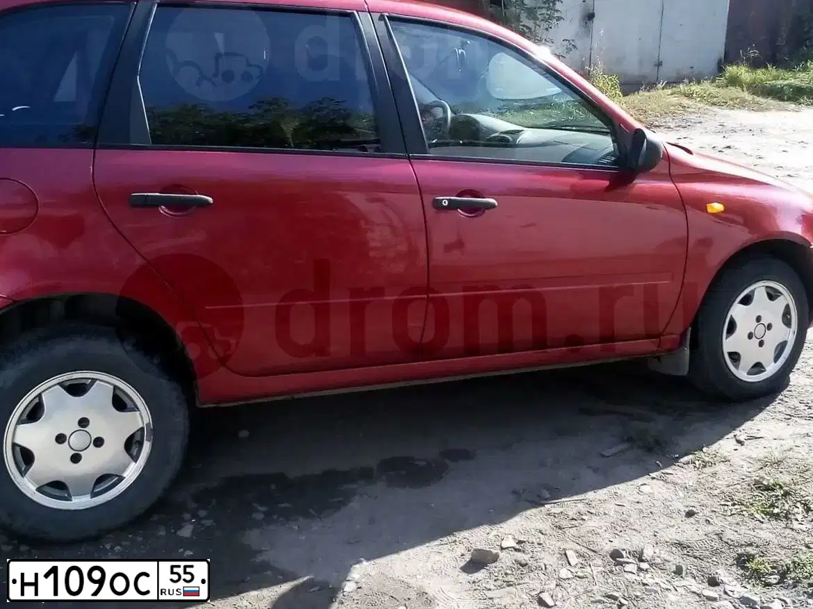 Фото автомобиля LADA 1117 KALINA, 2008 — госномер Н109ОС55. Цвет: СЕРЕБРИСТО-КРАСНЫЙ