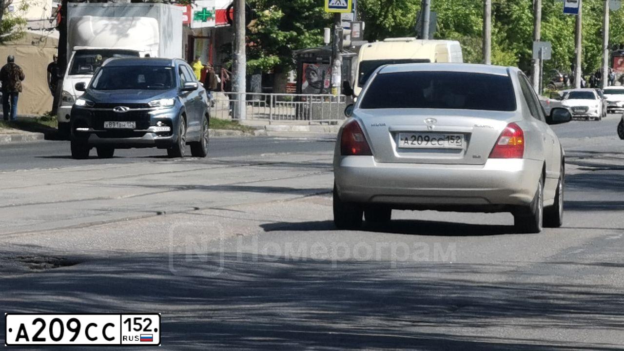 Фото автомобиля HYUNDAI ELANTRA, 2002 — госномер А209СС152. Цвет: СВЕТЛО-СЕРЫЙ