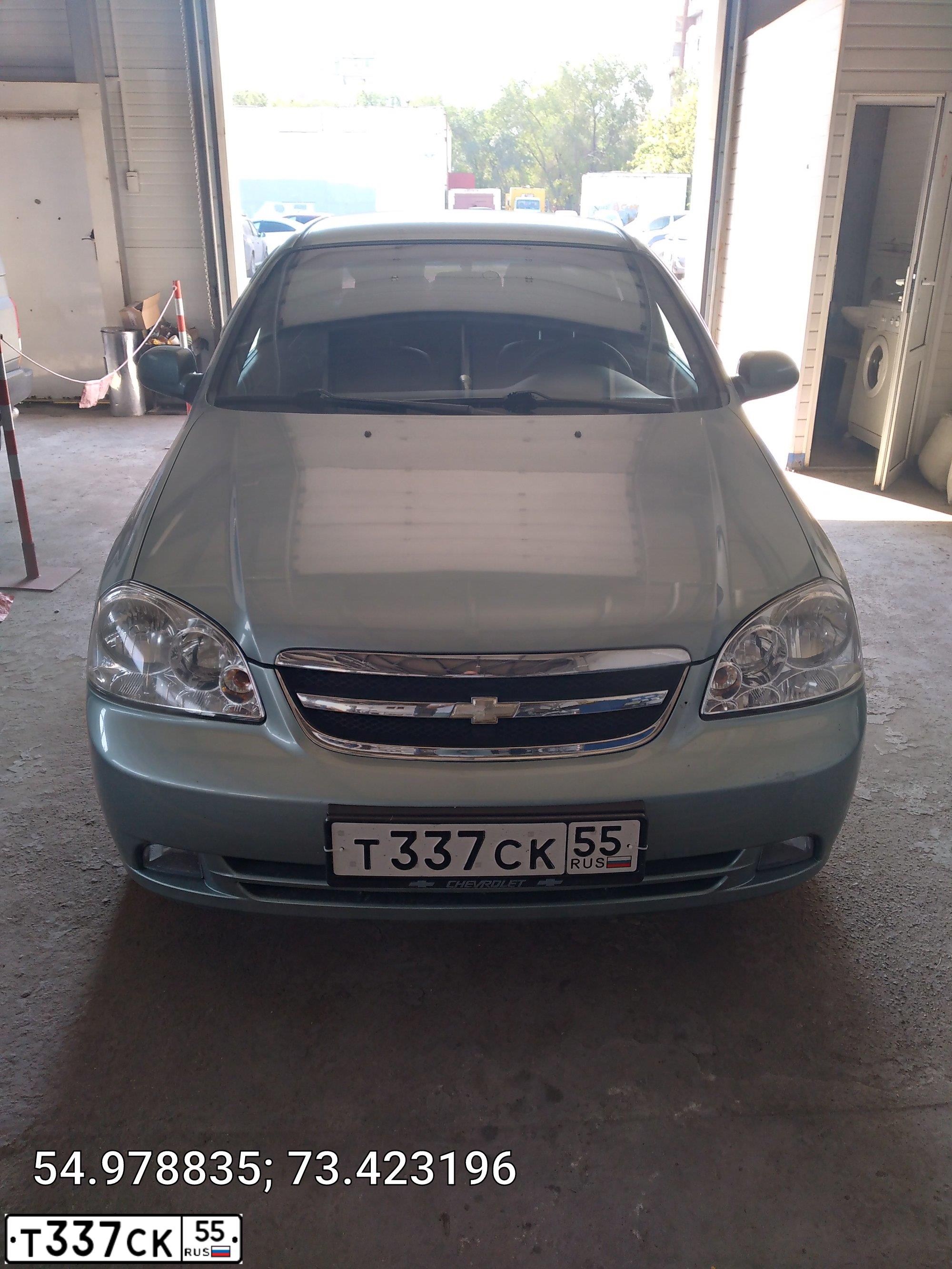 Фото автомобиля CHEVROLET LACETTI, 2005 — госномер Т337СК55. Цвет: СЕРО-ЗЕЛЕНЫЙ