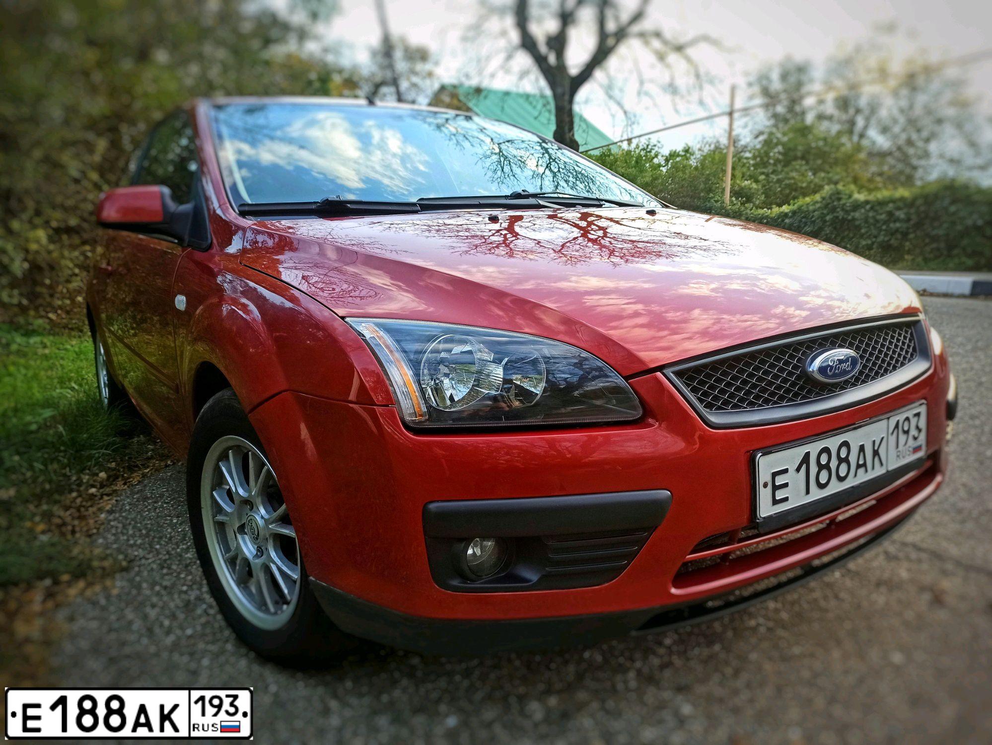 Фото автомобиля FORD FOCUS, 2005 — госномер Х575ОН86. Цвет: КРАСНО-ОРАНЖЕВЫЙ