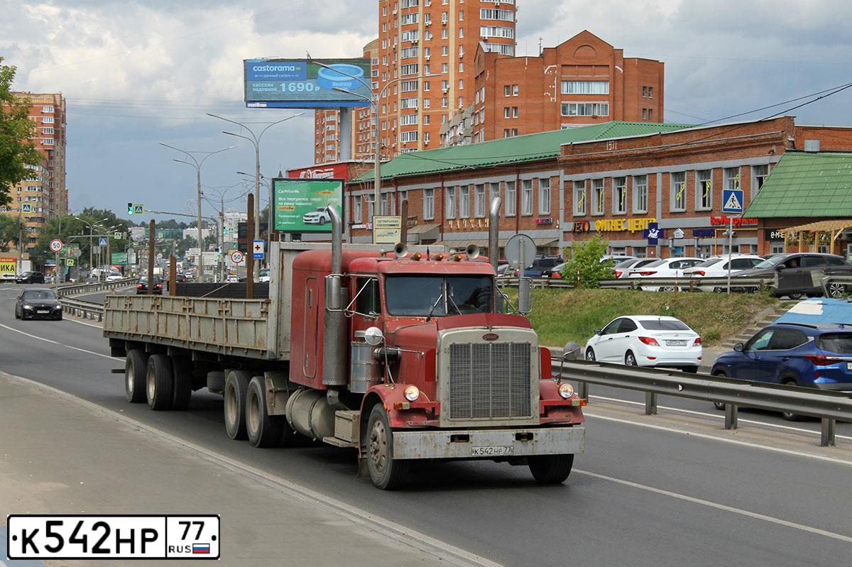 Фото автомобиля PETERBILT 359, 1985 — госномер К542НР77. Цвет: КРАСНЫЙ