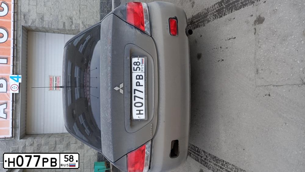 Фото автомобиля MITSUBISHI LANCER, 2007 — госномер Х970СН31. Цвет: ЧЕРНЫЙ