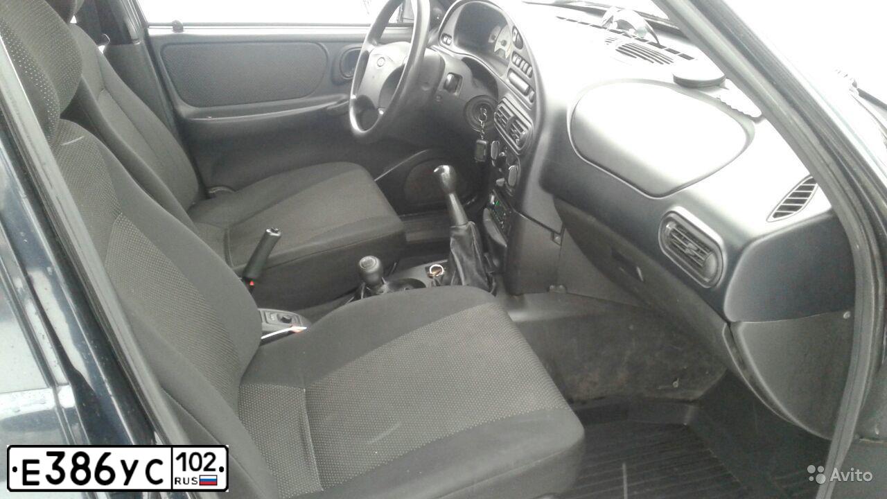 Фото автомобиля CHEVROLET NIVA, 2007 — госномер О660УР174. Цвет: Черно-синий металлик