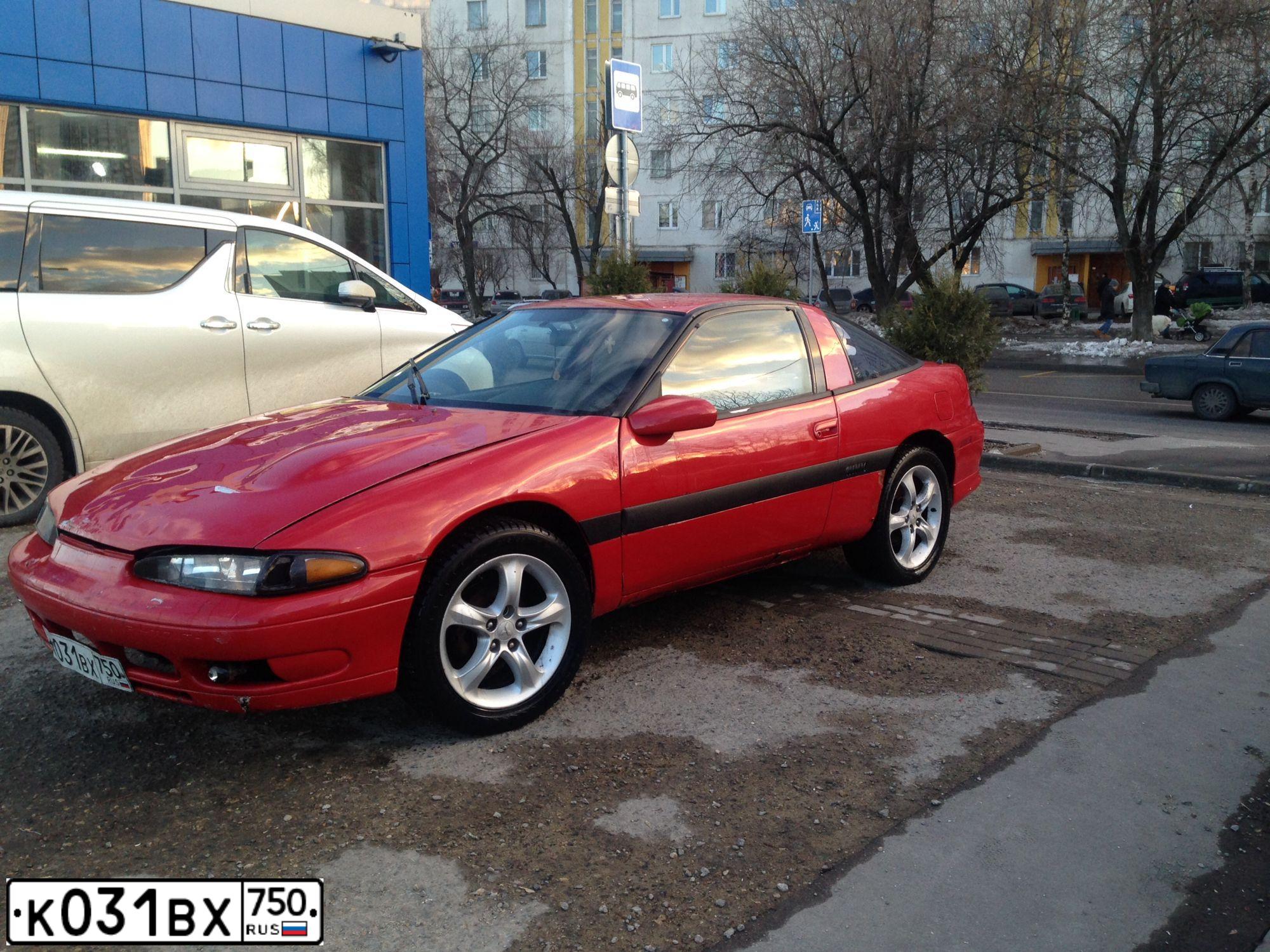 Фото автомобиля PLYMOUTH LASER, 1992 — госномер К031ВХ750. Цвет: Красный