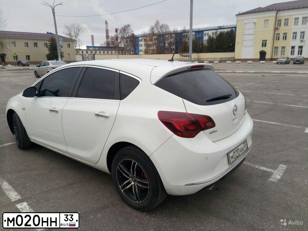 Фото автомобиля RENAULT LOGAN, 2010 — госномер М020НН33. Цвет: Красный