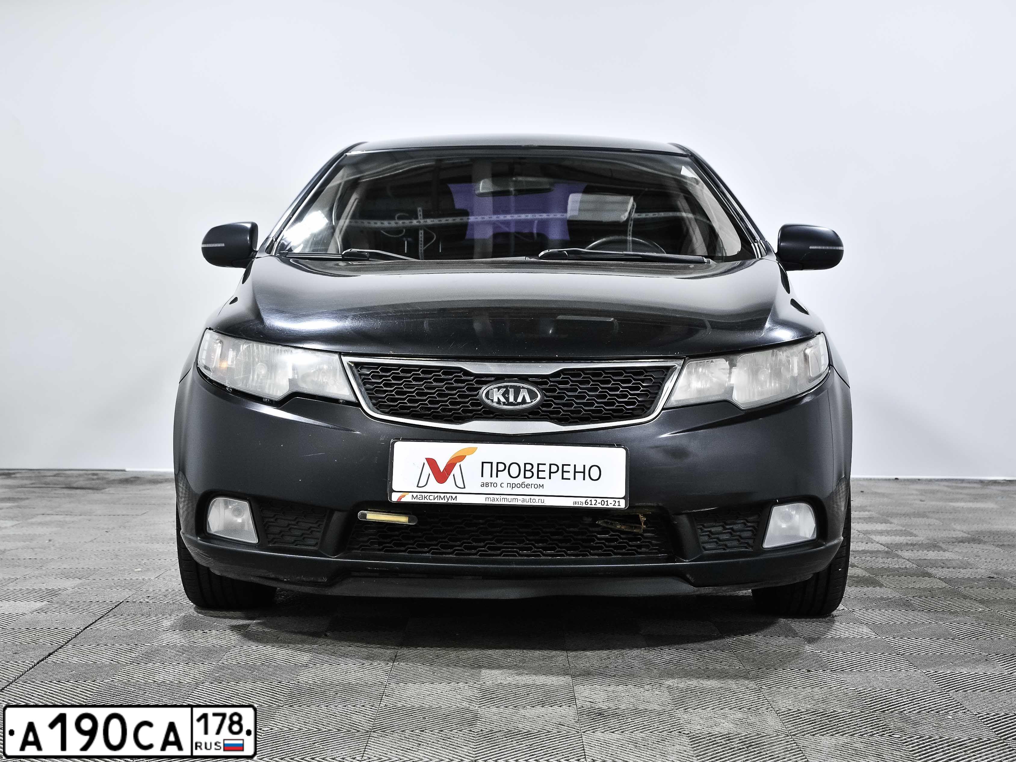 Фото автомобиля КИА CERATO, 2010 — госномер К382НР147. Цвет: ЧЕРНЫЙ