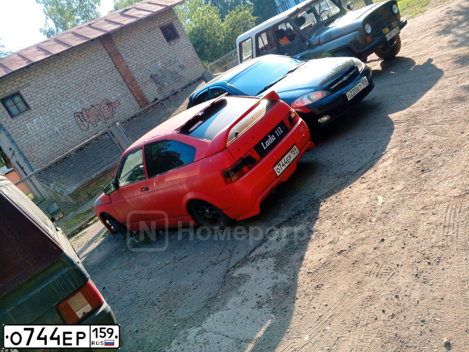 Фото автомобиля LADA 2112, 2008 — госномер О744ЕР159. Цвет: Красный