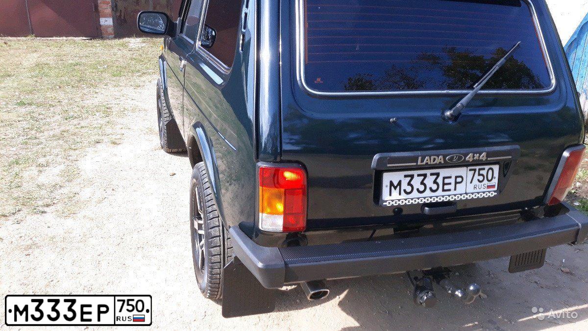 Фото автомобиля LADA 2121 NIVA, 2012 — госномер Х185ТВ750. Цвет: ТЕМНО-ЗЕЛЕНЫЙ