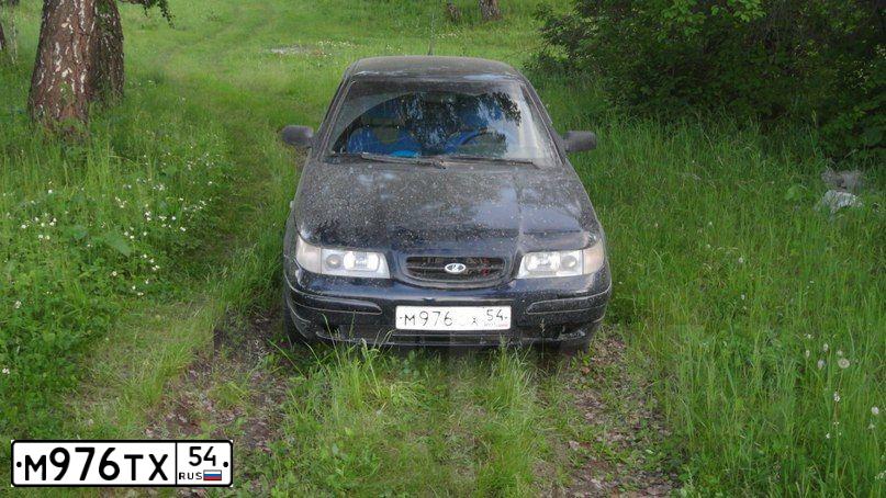 Фото автомобиля KRAZ 6233 /6X6/, 2007 — госномер М976ТХ54. Цвет: ОРАНЖЕВЫЙ