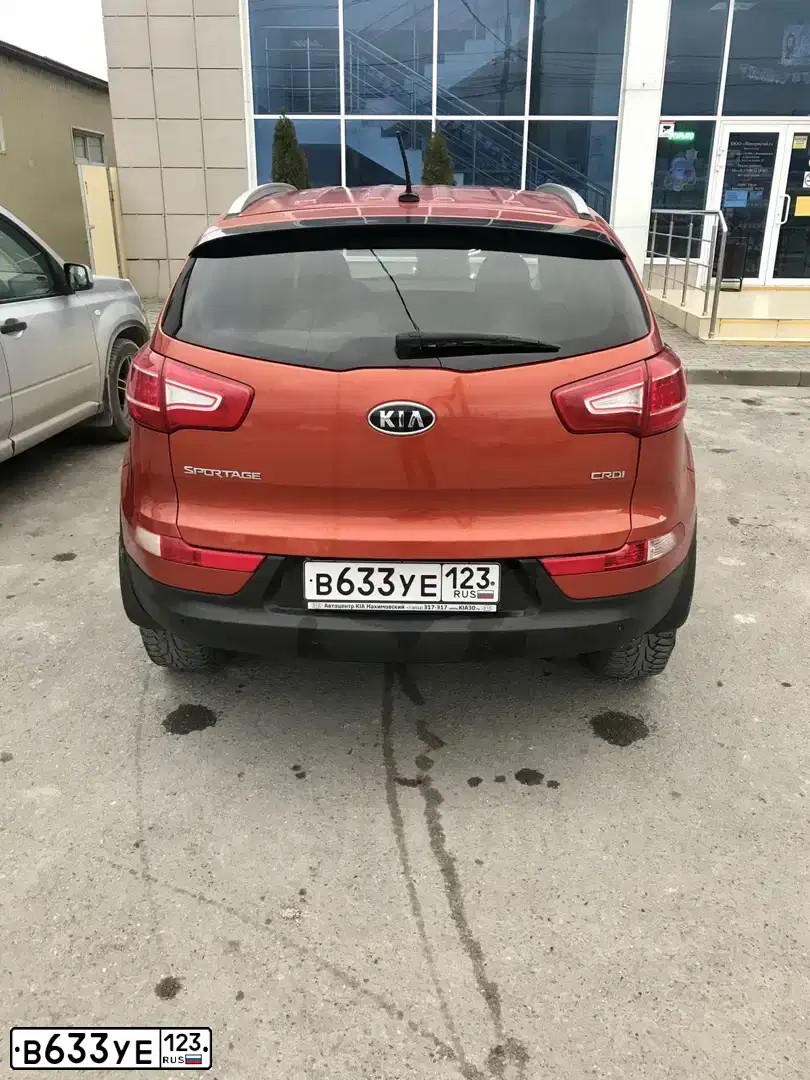 Фото автомобиля KIA SPORTAGE, 2011 — госномер С539МК30. Цвет: ОРАНЖЕВЫЙ