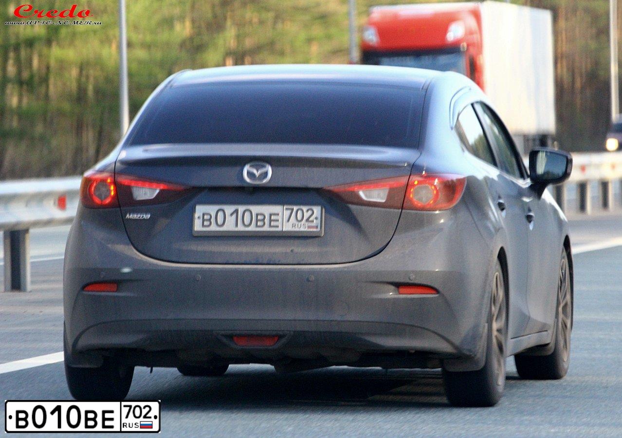 Фото автомобиля MAZDA 3, 2013 — госномер В010ВЕ702. Цвет: Серо-Синий