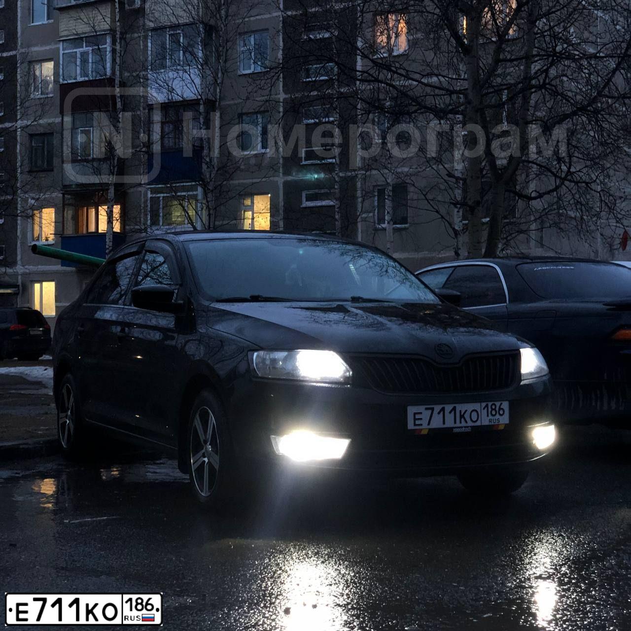 Фото автомобиля SKODA RAPID, 2017 — госномер Е711КО186. Цвет: ЧЕРНЫЙ