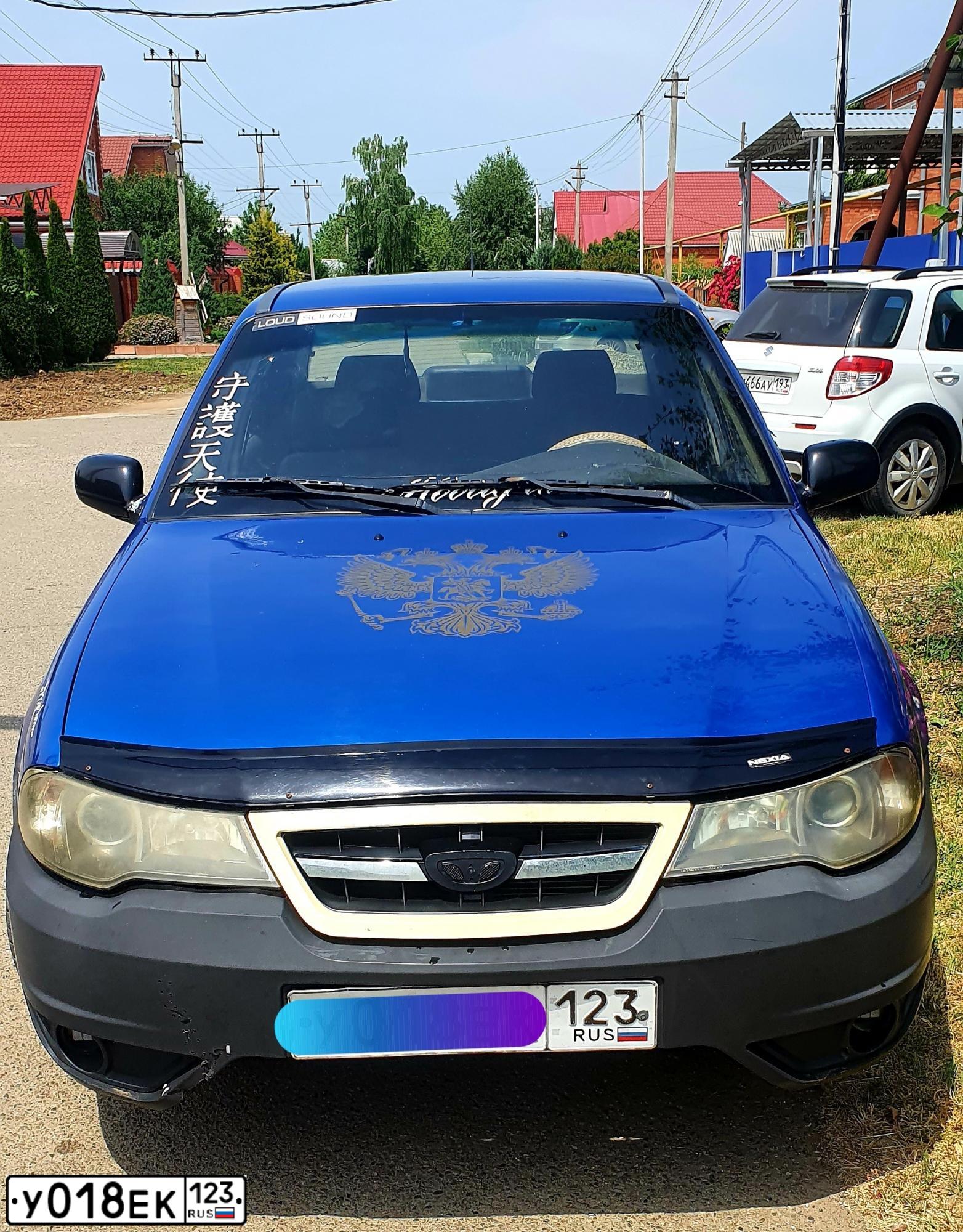 Фото автомобиля DAEWOO O NEXIA, 2012 — госномер Е169ЕС01. Цвет: СИНЕ-ГЛАЗУРИСТЫЙ