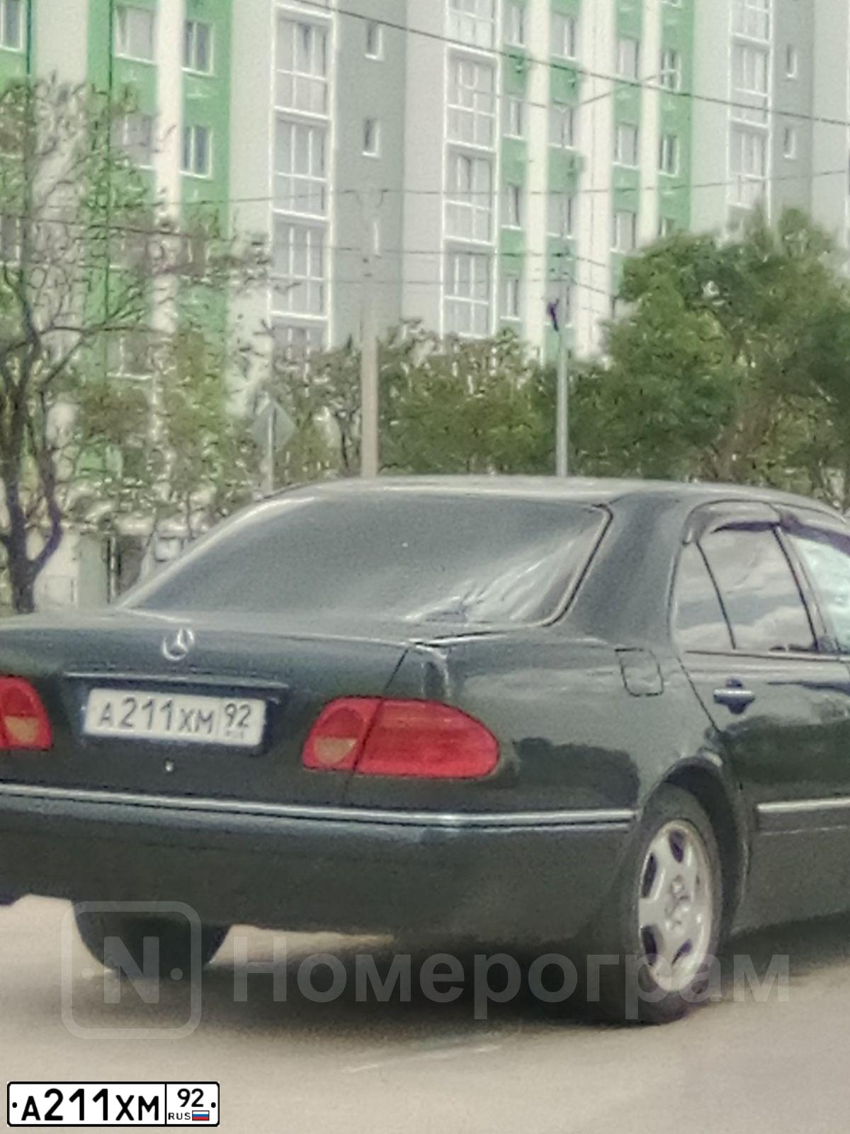 Фото автомобиля MERCEDES E-KLASSE, 1997 — госномер А211ХМ92. Цвет: ЧЕРНО-СИНИЙ