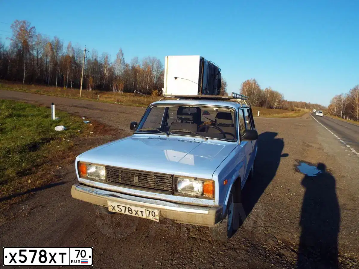 Фото автомобиля LADA 2104, 2005 — госномер Н730КМ70. Цвет: СВЕТЛО-ГОЛУБОЙ