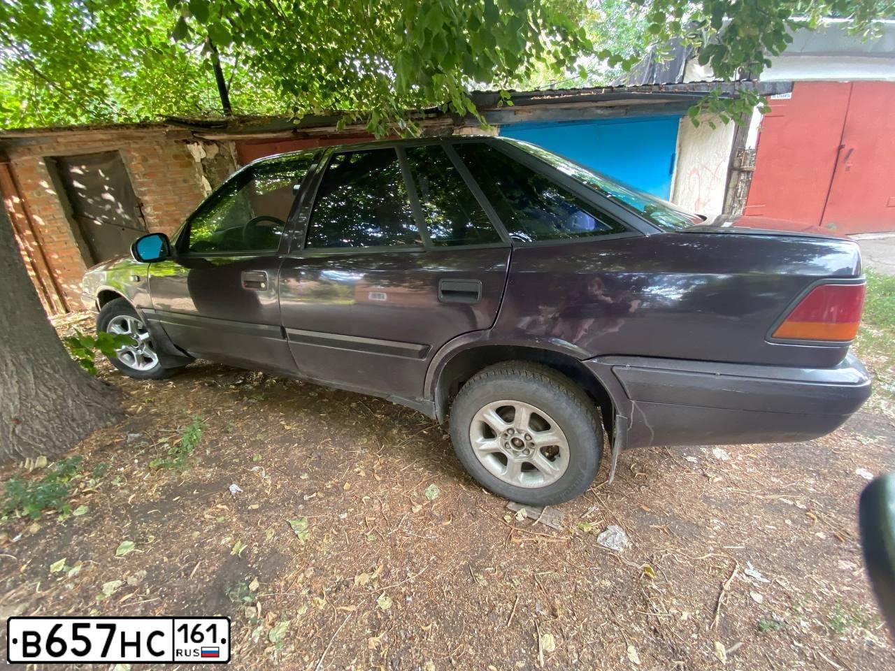 Фото автомобиля DAEWOO ESPERO, 1996 — госномер А145ТХ161. Цвет: ФИОЛЕТОВЫЙ
