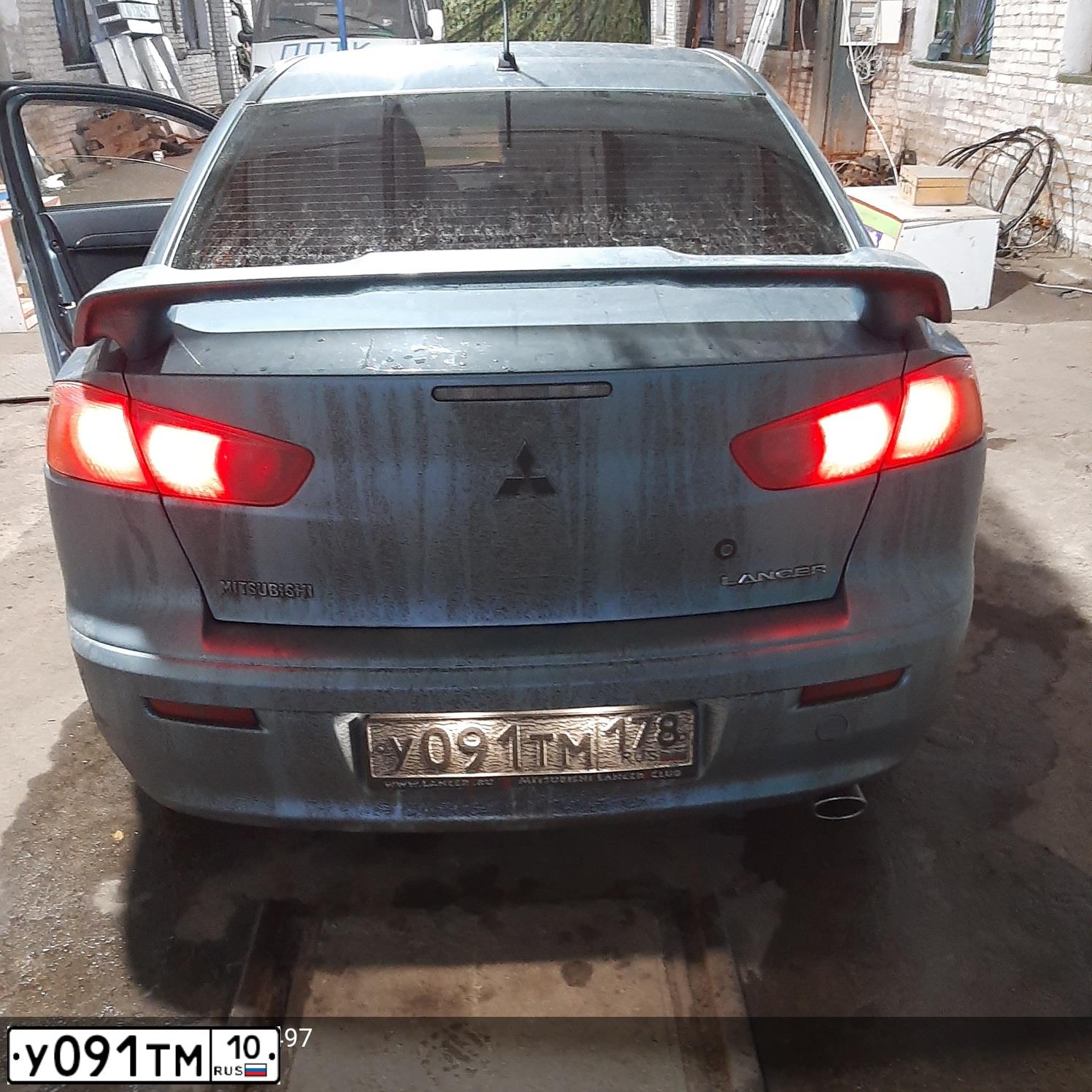 Фото автомобиля MITSUBISHI LANCER, 2008 — госномер К404РХ40. Цвет: СВЕТЛО-СЕРО-ЗЕЛЕНЫЙ